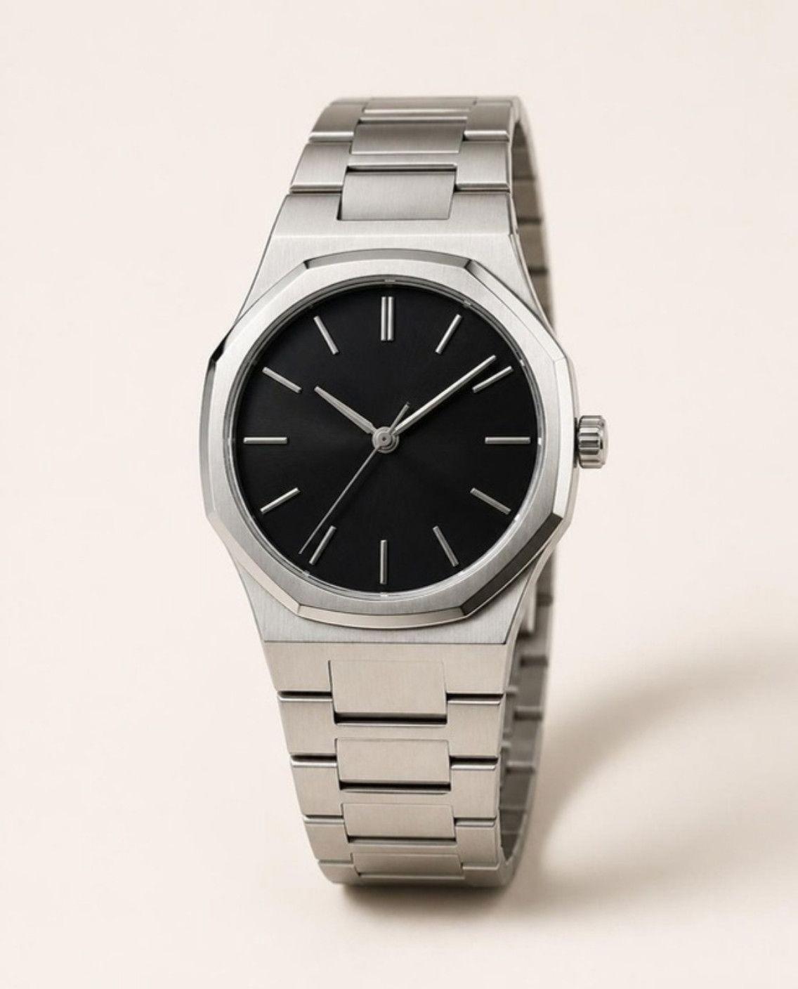 Hexa 38 Automatic with a black dial on a steel bracelet
